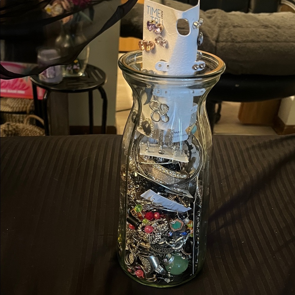 Assorted Jewelry Collection in Glass Vase